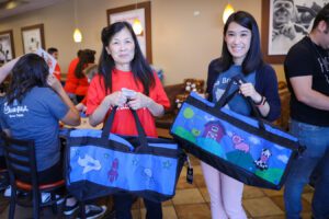 Mother and daughter decorates sweet cases